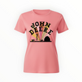 John Deere Barn Scene Silhouette Ladies T-Shirt in pink with black farm silhouette and bold logo, ideal for casual wear and farm-inspired fashion.